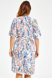 Model Laura wearing size 12 of the Belle Scatter Floral Kimono Sleeve Dress in colour Scatfloral, from the back