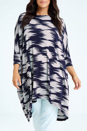 Model Laura wearing size M of the Belle Printed Throw Over in colour Strokes (Blue), from the front, cropped image