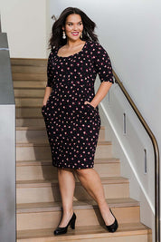 Model Lauren wearing size 16 of the Belle Ditsy Floral Print Bengaline Dress in colour Ditsy (Black), from the front, showing the whole outfit