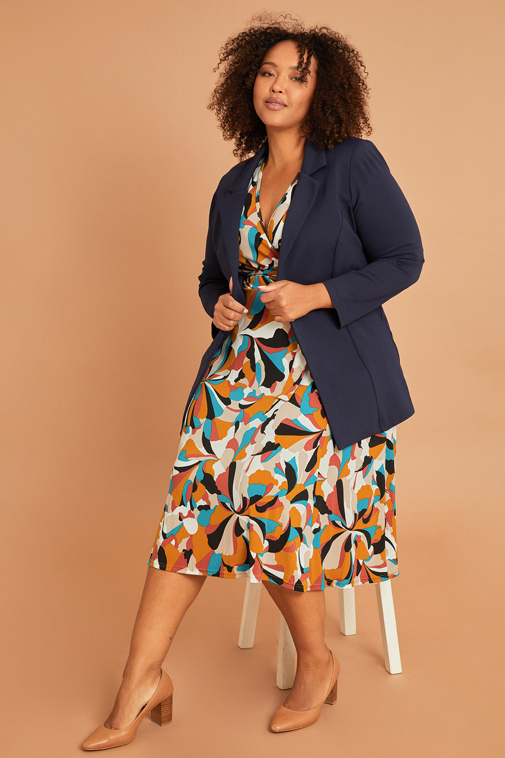Model Alexis wearing size 16 of the Belle X Over Full Skirt Dress in colour Multiprint, from the front, showing the whole outfit