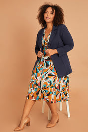 Model Alexis wearing size 16 of the Belle X Over Full Skirt Dress in colour Multiprint, from the front, showing the whole outfit