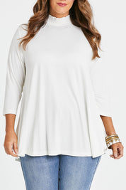 Model Laura wearing size 14 of the Belle Turtleneck Draped Bamboo Tee in colour Ivory (White), from the front, cropped image