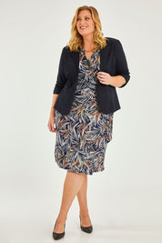 Model Caitlin wearing size 20 of the Belle Classic Lined Wrap Jersey Dress in colour Navyprint (Blue), from the front, showing the whole outfit