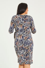 Model Terri-Leigh wearing size 14 of the Belle Classic Lined Wrap Jersey Dress in colour Navyprint (Blue), from the back