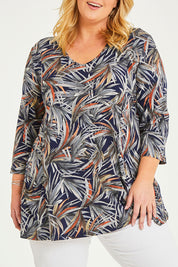 Model Caitlin wearing size 20 of the Belle Jersey Tee With Pocket Detail in colour Navyprint (Blue), from the front, cropped image