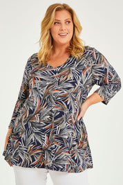 Model Caitlin wearing size 20 of the Belle Jersey Tee With Pocket Detail in colour Navyprint (Blue), from the front, cropped image