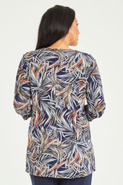 Model Terri-Leigh wearing size 14 of the Belle Jersey Tee With Pocket Detail in colour Navyprint (Blue), from the back