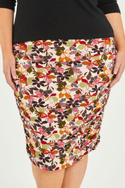 Model Caitlin wearing size 20 of the Belle Lined Side Gathered Skirt in colour Floral (White), from the front, cropped image