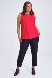 Model Monique wearing size 14 of the Belle Luxe Bamboo Tank in colour Lipstick (Pink), from the front, showing the whole outfit