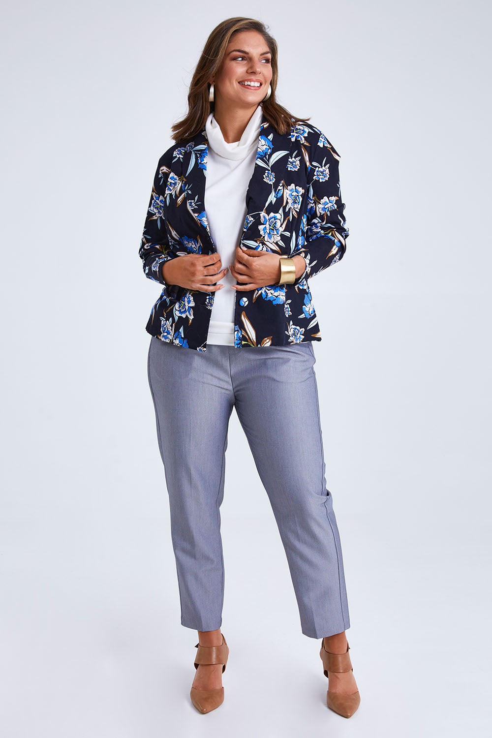 Model Monique wearing size 14 of the Belle Stretch Printed Blazer in colour Bluefloral (Blue), from the front, showing the whole outfit