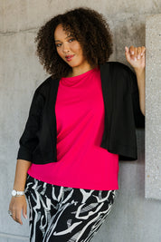 Model Alexis wearing size 16 of the Belle Cotton Sateen Cropped Jacket in colour Black (Black), from the front, cropped image