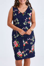 Model Monique wearing size 14 of the Belle V Neck Cotton Sateen Print  Dress in colour Bluefloral (Blue), from the front, cropped image