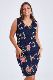 Model Monique wearing size 14 of the Belle V Neck Cotton Sateen Print  Dress in colour Bluefloral (Blue), from the front, cropped image