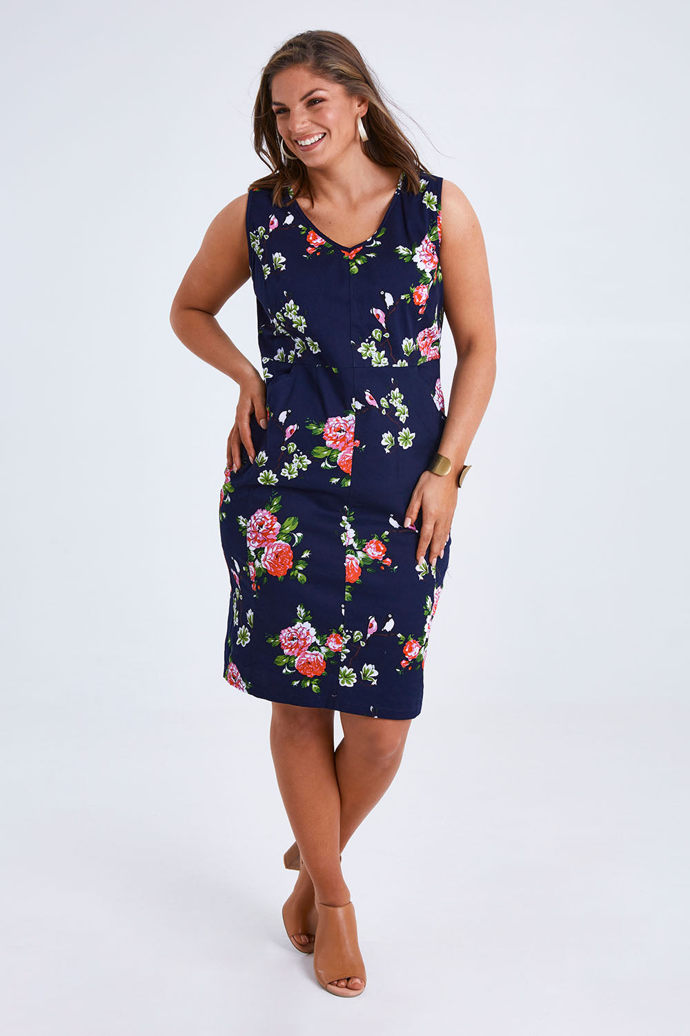 Model Monique wearing size 14 of the Belle V Neck Cotton Sateen Print  Dress in colour Bluefloral (Blue), from the front, showing the whole outfit