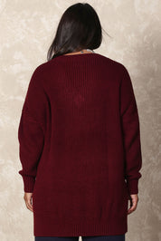 Model Ashleigh wearing size XL of the Belle Cosy V Neck Jumper in colour Burgundy (Purple), from the back