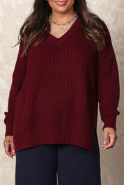 Model Ashleigh wearing size XL of the Belle Cosy V Neck Jumper in colour Burgundy (Purple), from the front, cropped image