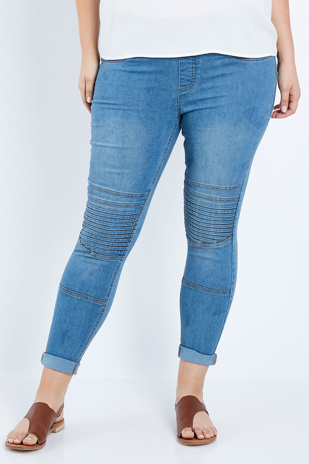 Model Jess wearing size 14 of the Wild Heart Stitched Jeggings in colour Lightdenim (Blue), from the front, cropped image