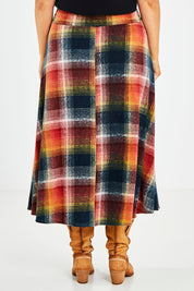 Model Jess wearing size 14 of the Chasing The Clouds Away Maxi Skirt in colour Sunset (Black), from the back
