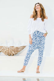 Model Ilona wearing size 10 of the A Pocket Full Of Flowers Pants in colour Bluefleur (Blue), from the front, showing the whole outfit
