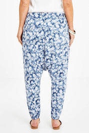 Model Laura wearing size 14 of the A Pocket Full Of Flowers Pants in colour Bluefleur (Blue), from the back