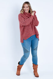 Model Jess wearing size L of the Soft Cloud Roll Neck Jumper in colour Brick (Red), from the front, showing the whole outfit