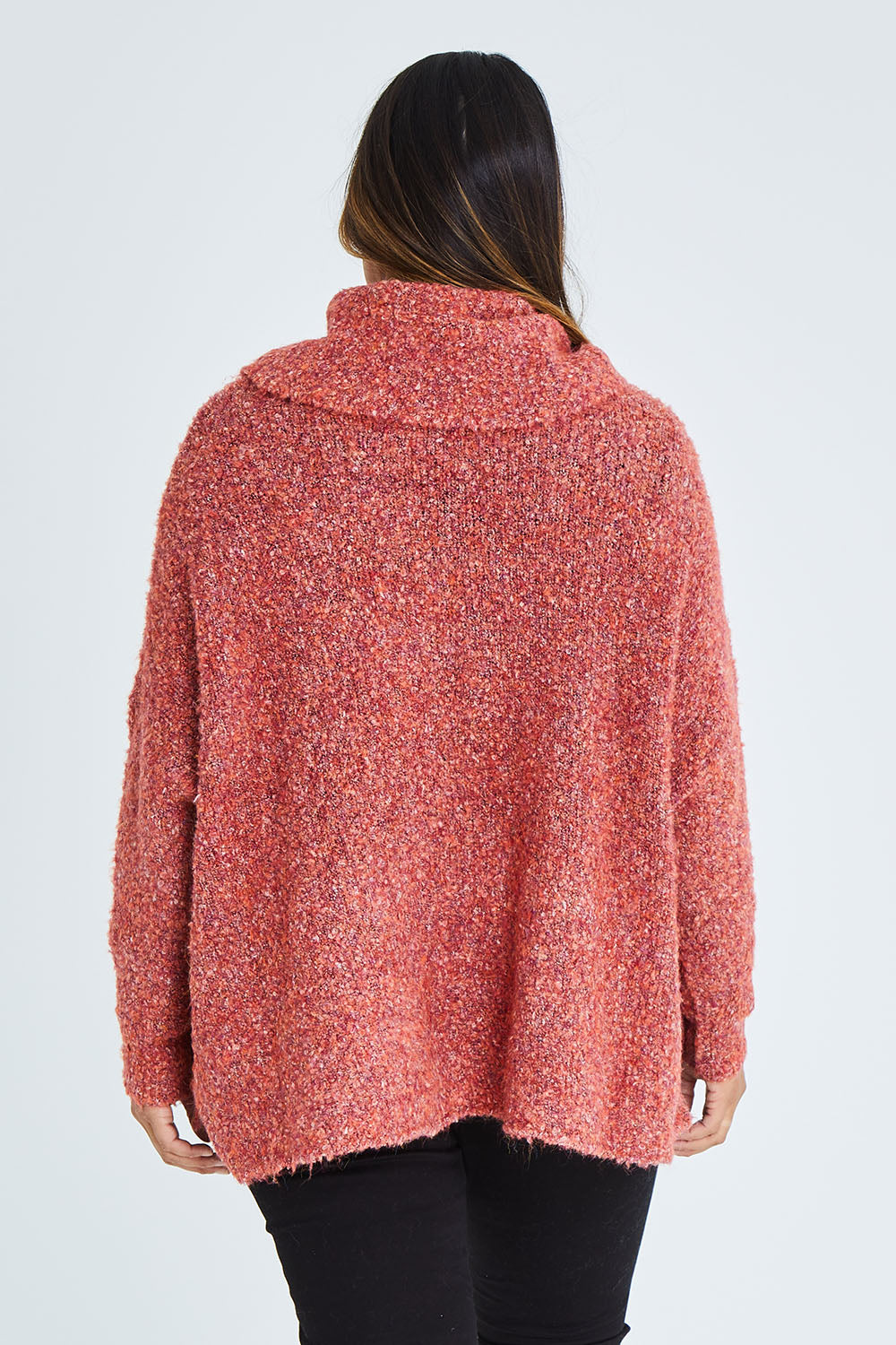 Model Palatina wearing size XL of the Soft Cloud Roll Neck Jumper in colour Brick (Red), from the back