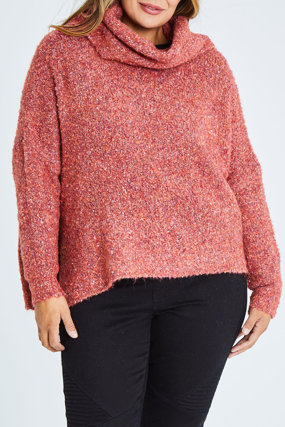 Model Palatina wearing size XL of the Soft Cloud Roll Neck Jumper in colour Brick (Red), from the front, cropped image