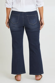 Model Laura wearing size 14 of the Easy As Pull On Jeans in colour Darkdenim (Blue), from the back