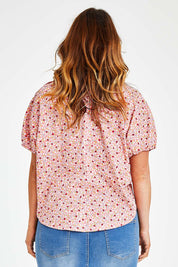 Model Laura wearing size 14 of the Its All In The Sleeve Cotton Blouse in colour Peach (Pink), from the back