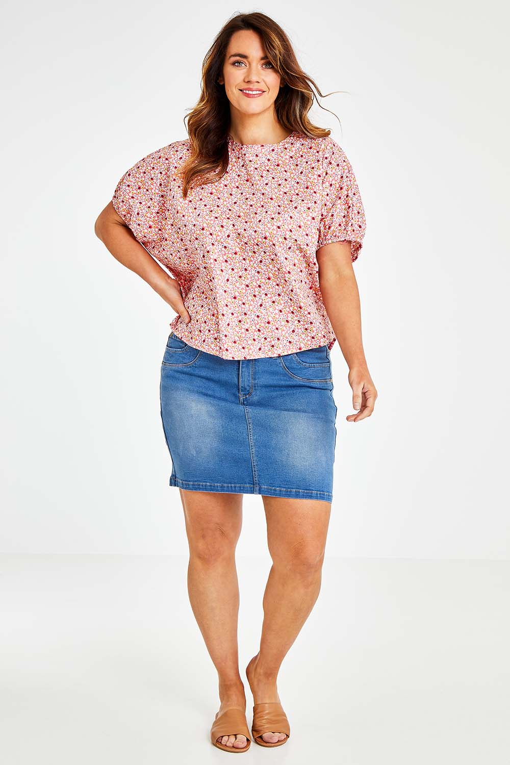Model Laura wearing size 14 of the Its All In The Sleeve Cotton Blouse in colour Peach (Pink), from the front, showing the whole outfit