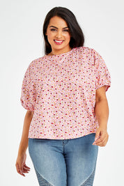 Model Sasha-Lee wearing size 16 of the Its All In The Sleeve Cotton Blouse in colour Peach (Pink), from the front, cropped image