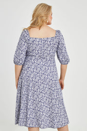 Model Keeara wearing size 16 of the Walking On Sunshine Dress in colour Navypais (Blue), from the back