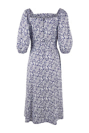 Product shot of the Walking On Sunshine Dress in colour Navypais (Blue), from the back
