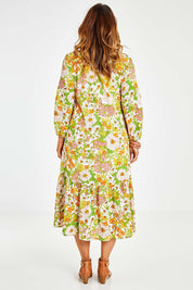 Model Laura wearing size 14 of the Daisy Chain Love Maxi Dress in colour Daisy (White), from the back