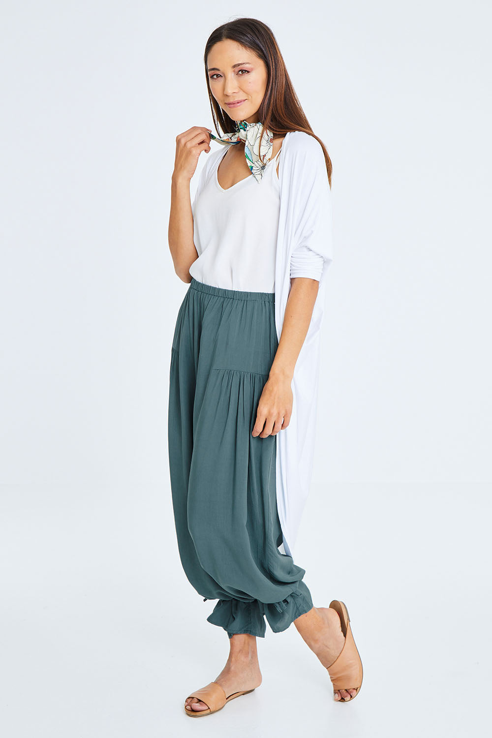 Model Cara wearing size 10 of the Endless Summer Side Gathered Pant in colour Forest (Green), from the front, showing the whole outfit