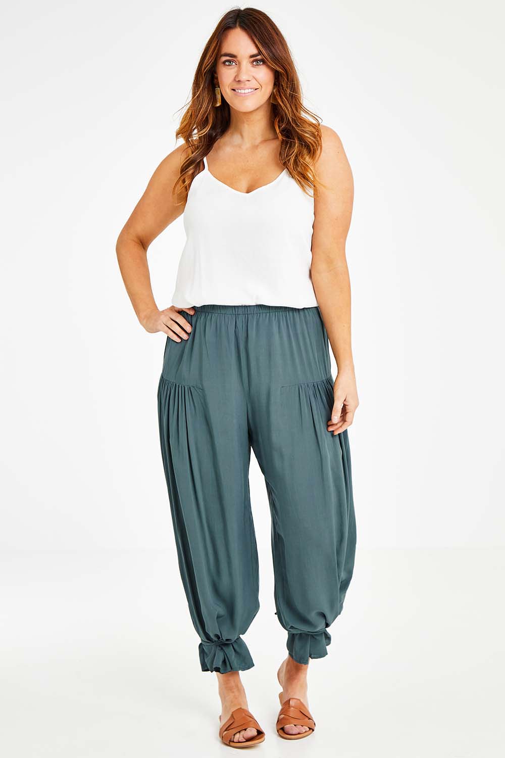 Model Laura wearing size 14 of the Endless Summer Side Gathered Pant in colour Forest (Green), from the front, showing the whole outfit