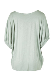 Product shot of the In My Arms Tee in colour Sage (Green), from the back