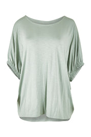 Product shot of the In My Arms Tee in colour Sage (Green), from the front