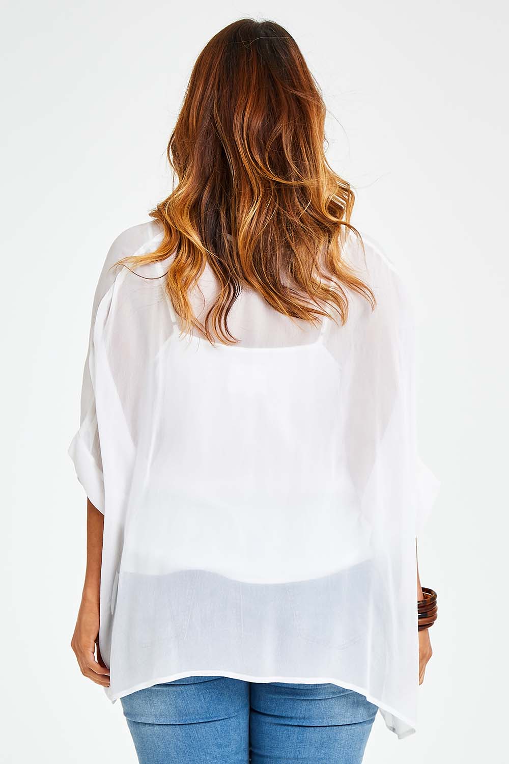 Model Laura wearing size 14 of the You See Through Me Blouse in colour White (White), from the back