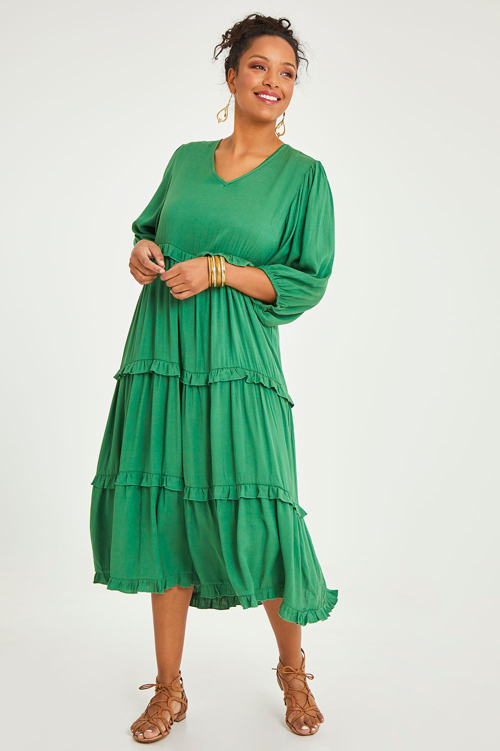 Model Noli wearing size 14 of the Tiers Of Laughter Maxi Dress in colour Emerald (Green), from the front, showing the whole outfit
