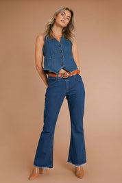 Model Alice wearing size 10 of the Fine and Dandy Denim Vest in colour Darkdenim (Blue), from the front, showing the whole outfit