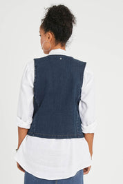 Model Noli wearing size 14 of the Preloved Fine and Dandy Denim Vest in colour Darkdenim (Blue), from the back