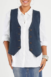 Model Noli wearing size 14 of the Preloved Fine and Dandy Denim Vest in colour Darkdenim (Blue), from the front, cropped image