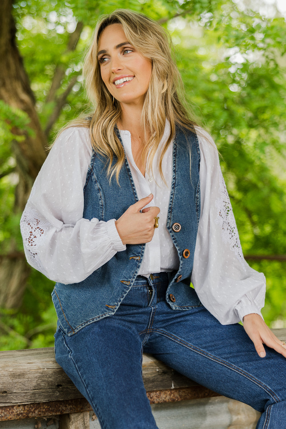 Model Tegan wearing size 10 of the Fine and Dandy Denim Vest in colour Darkdenim (Blue), from the front, showing the whole outfit