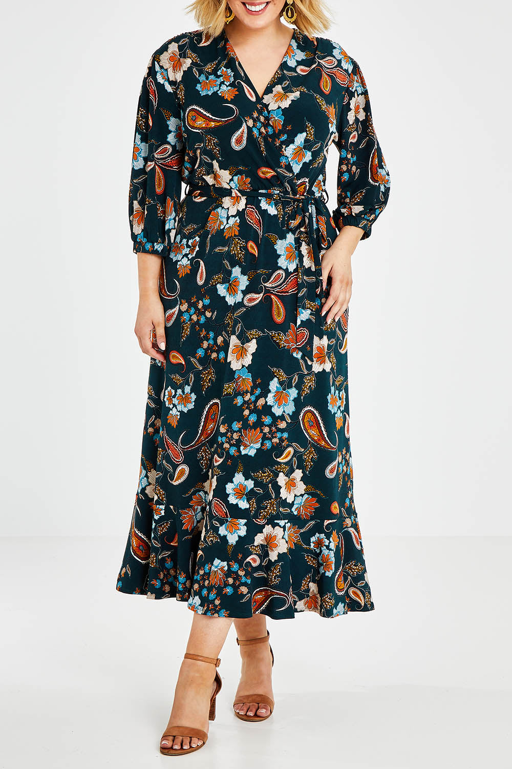 Model Jess wearing size 14 of the Feeling Free Faux Wrap Dress in colour Greenbay (Green), from the front, cropped image