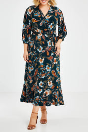 Model Jess wearing size 14 of the Feeling Free Faux Wrap Dress in colour Greenbay (Green), from the front, cropped image