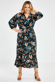 Model Jess wearing size 14 of the Feeling Free Faux Wrap Dress in colour Greenbay (Green), from the front, showing the whole outfit