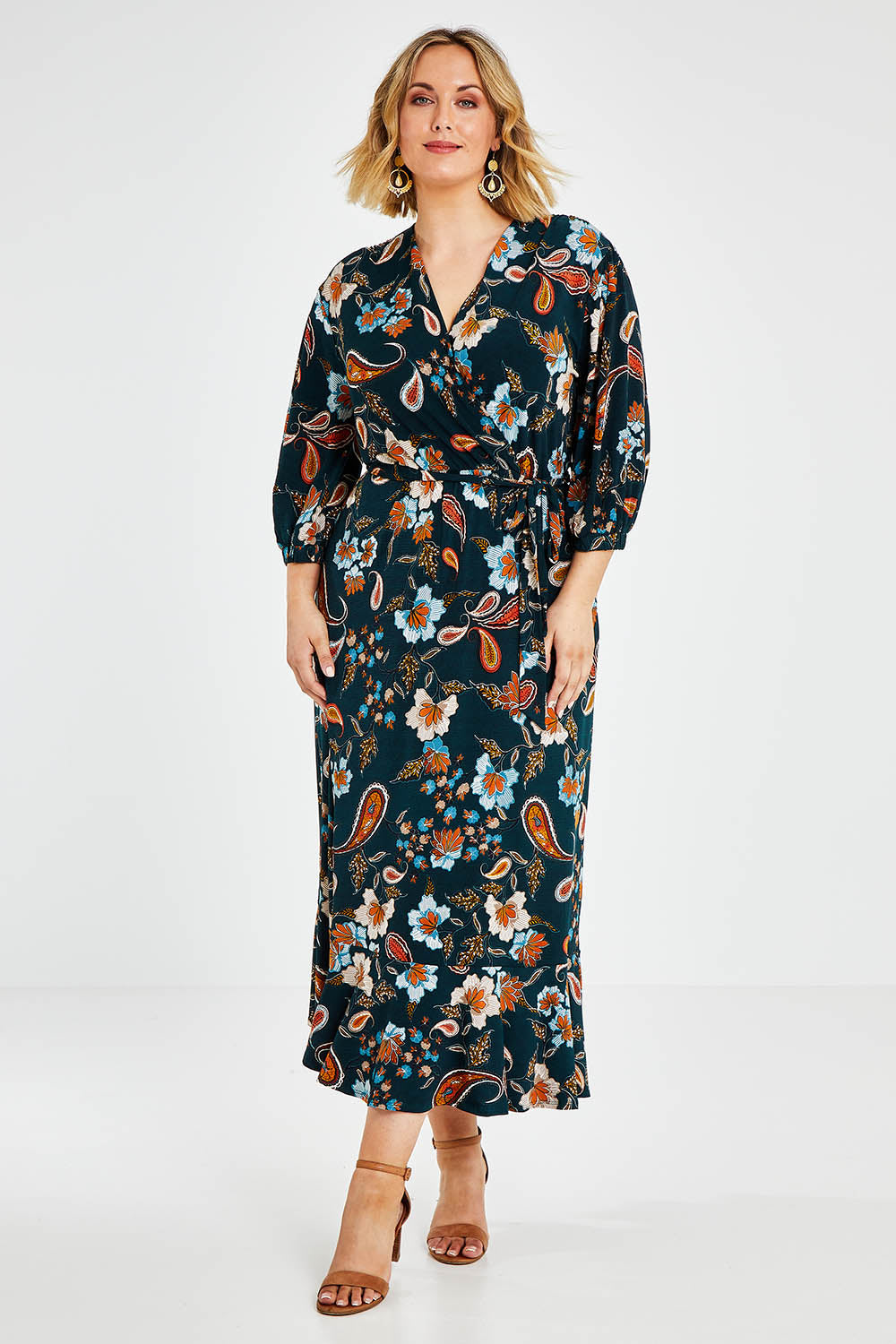 Model Jess wearing size 14 of the Feeling Free Faux Wrap Dress in colour Greenbay (Green), from the front, showing the whole outfit