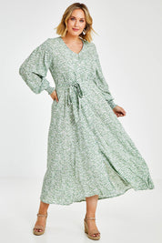 Model Jess wearing size 14 of the Field Of Dreams Button Up Dress in colour Greenfleur (Green), from the front, showing the whole outfit