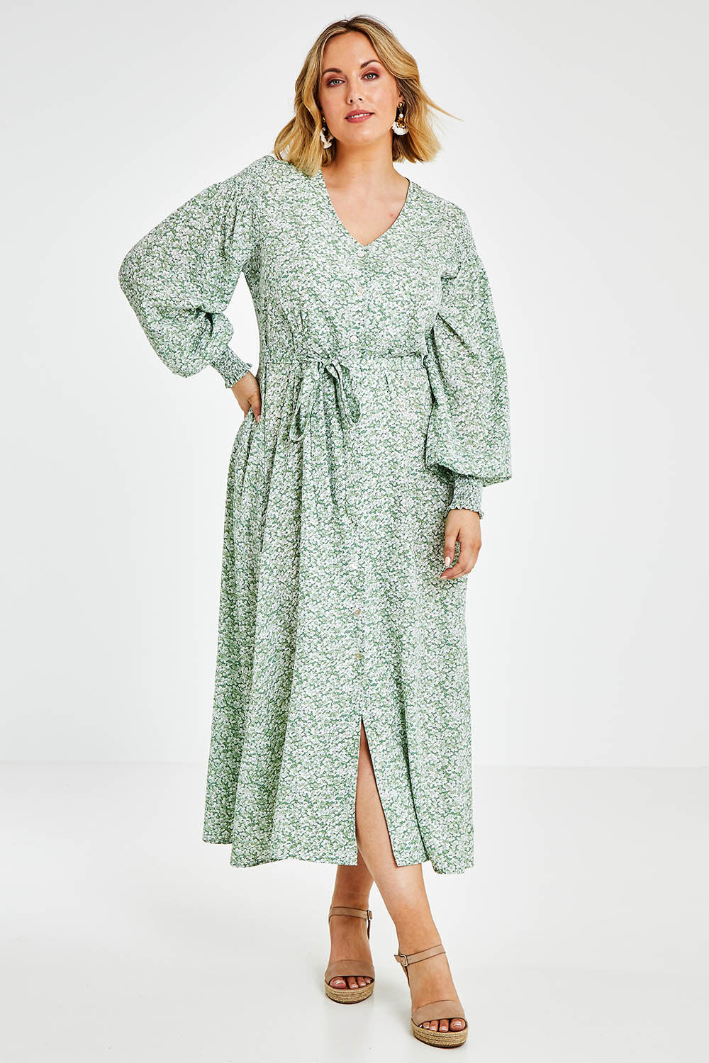 Model Jess wearing size 14 of the Field Of Dreams Button Up Dress in colour Greenfleur (Green), from the front, showing the whole outfit
